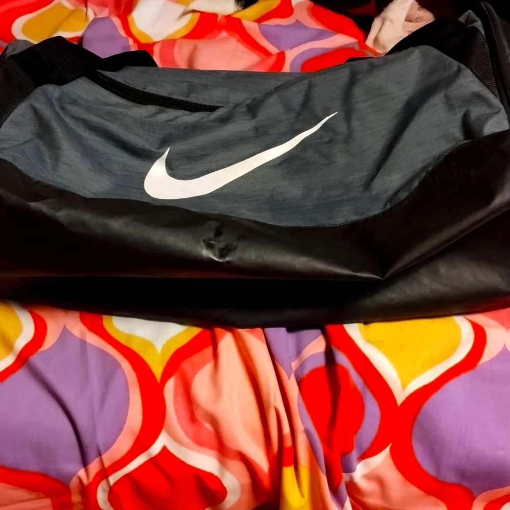 Nike charcoal gray and black gym bag.